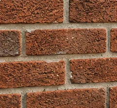 Chimney tuckpointing with renewed mortar joints
